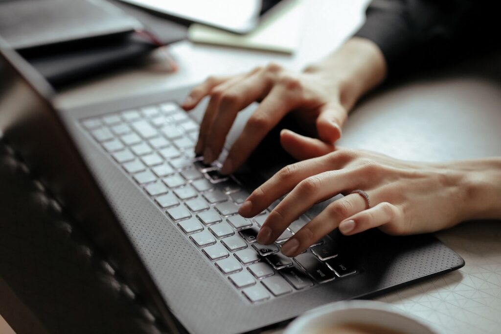 Woman typing on laptop