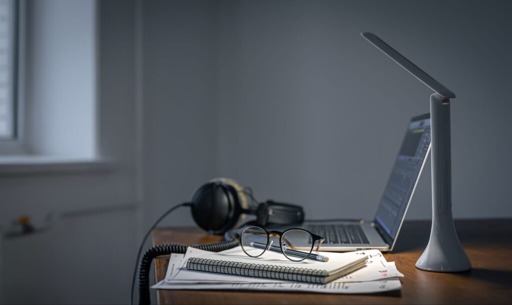 Workplace with headphones and laptop